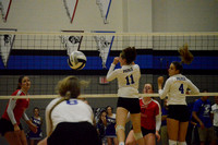 Abby Hochstein's spike makes it past the two blockers, but Pierce's Maggie Brahmeris there for the return