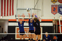 Abbe Morten spike with Kaitlyn Heimes and Katelyn Heine attempting to block