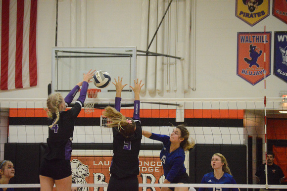 Belle Harms and Hailey Gottsche just miss a block on a Shaelee Planer spike