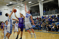 Ethan Lammers goes  up for contested layup