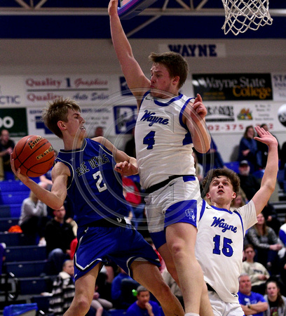 BKB Wayne v Wynot   Dylan Heine (2) of Wynot looks for a teammate as he saves the ball from going out of bounds as Drue Davis (4) and Jace Jorgensen (15) of Wayne defend Thursday  in Wayne.05
