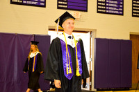 Tyler Baue walking at start of graduation